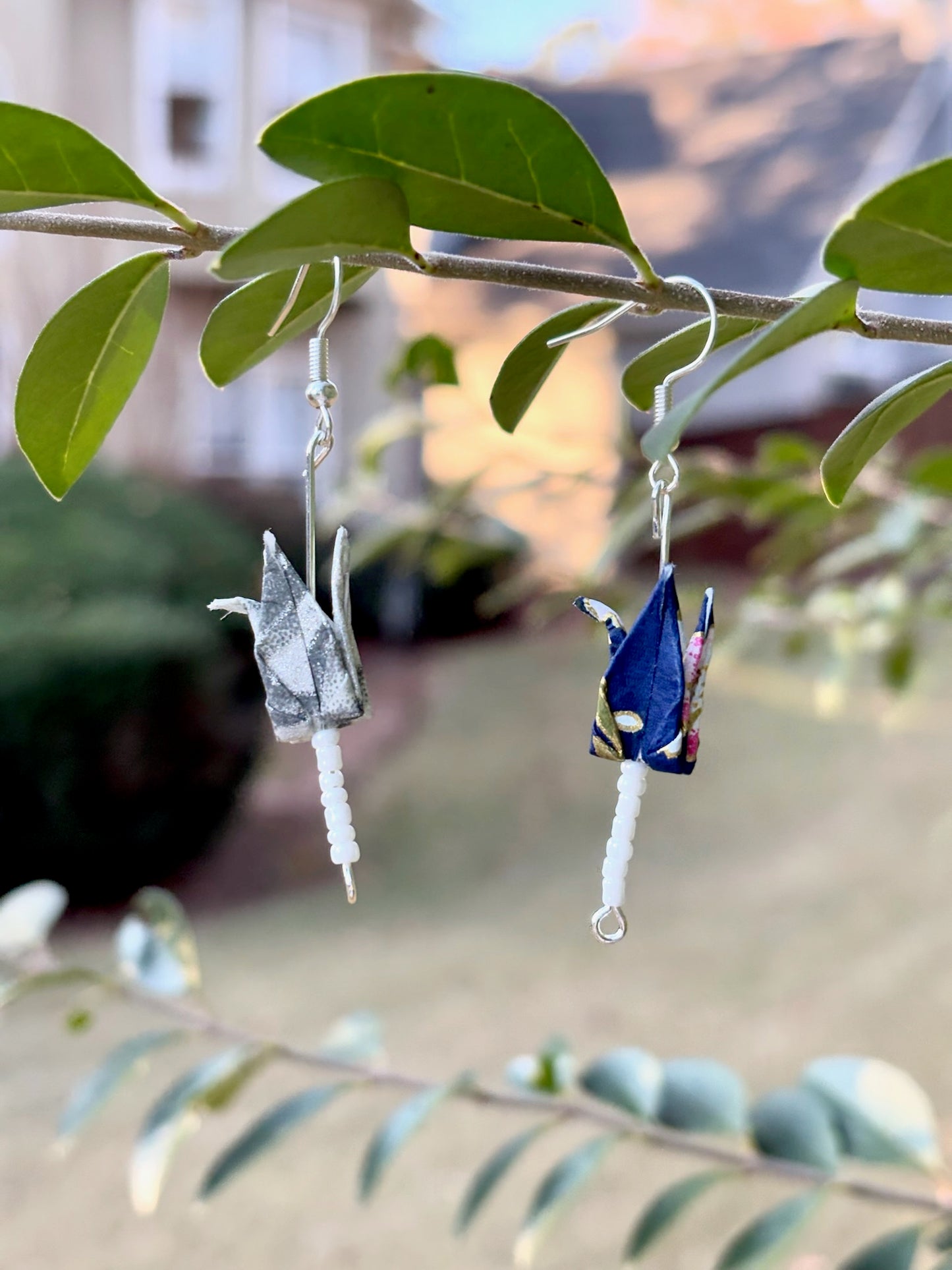Mismatched crane earrings with beads